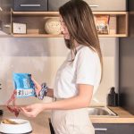 a woman holding a bag of cookies